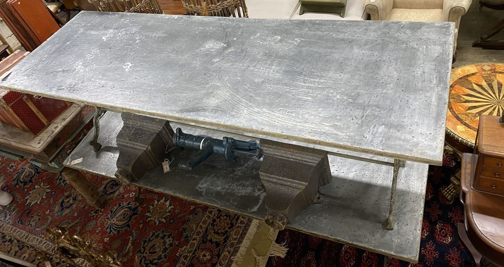 A Victorian style rectangular cast iron garden table with tin top, width 210cm, depth 69cm, height 71cm